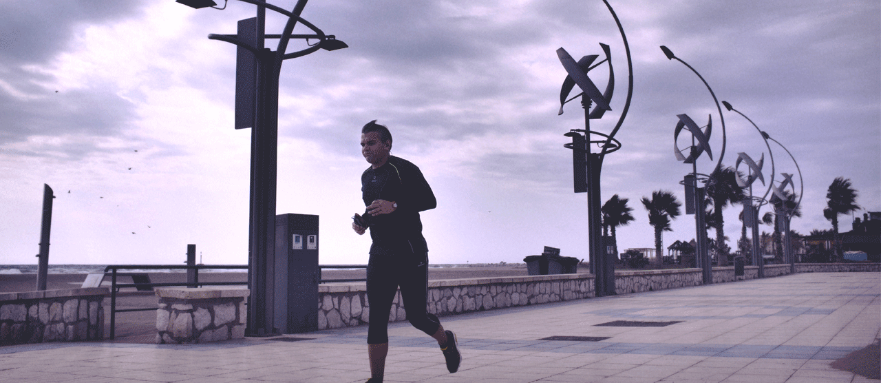 Man running in a sustainable city